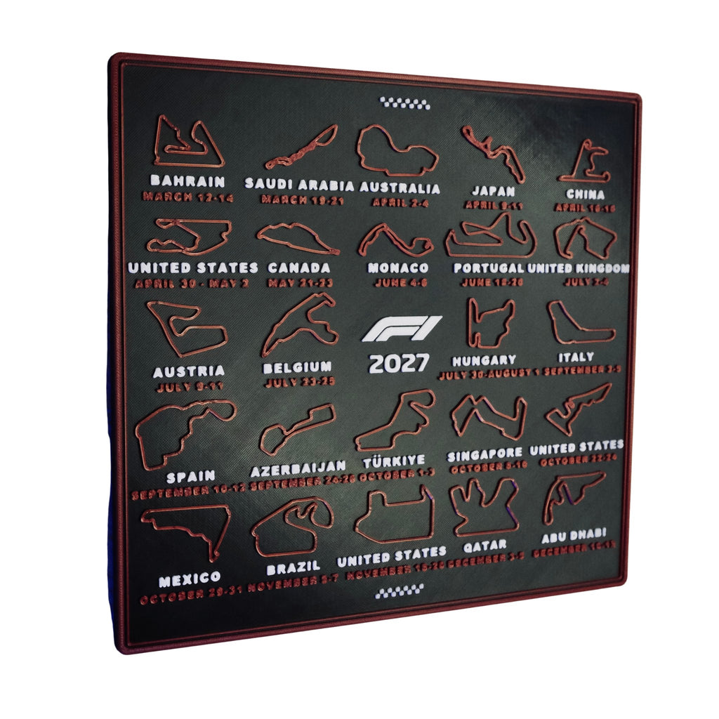 Angled view of the 3D printed 2027 race calendar showing the raised red tracks and frame