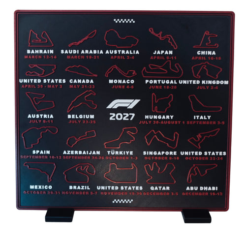 3D printed 2027 race calendar by RU3D – red circuit maps on a charcoal display, standing on its two stand feet