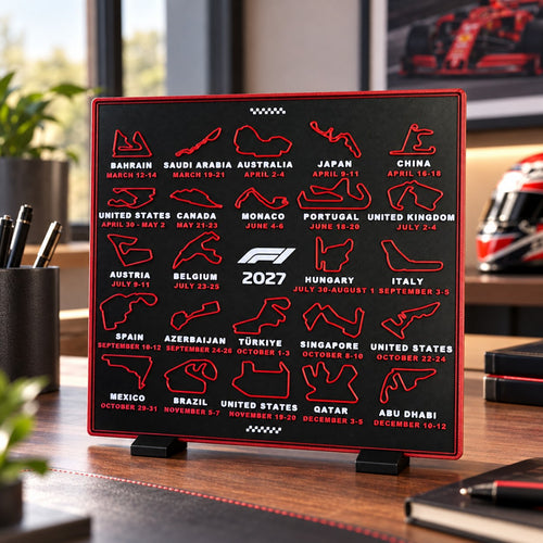3D printed 2027 race calendar by RU3D on a desk – red circuit maps and race dates on a charcoal display, standing on its printed feet