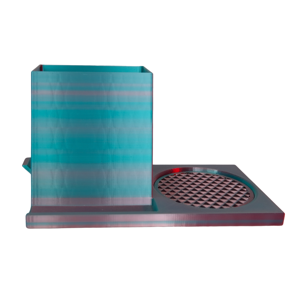A minimalist blue box with a glossy finish and an interlocking design feature next to a flat, textured surface.