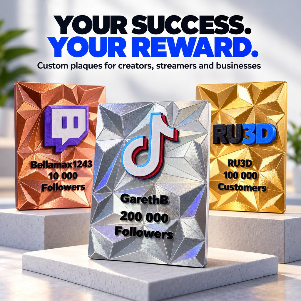 Three RU3D 3D printed reward plaques in copper, silver and gold on display