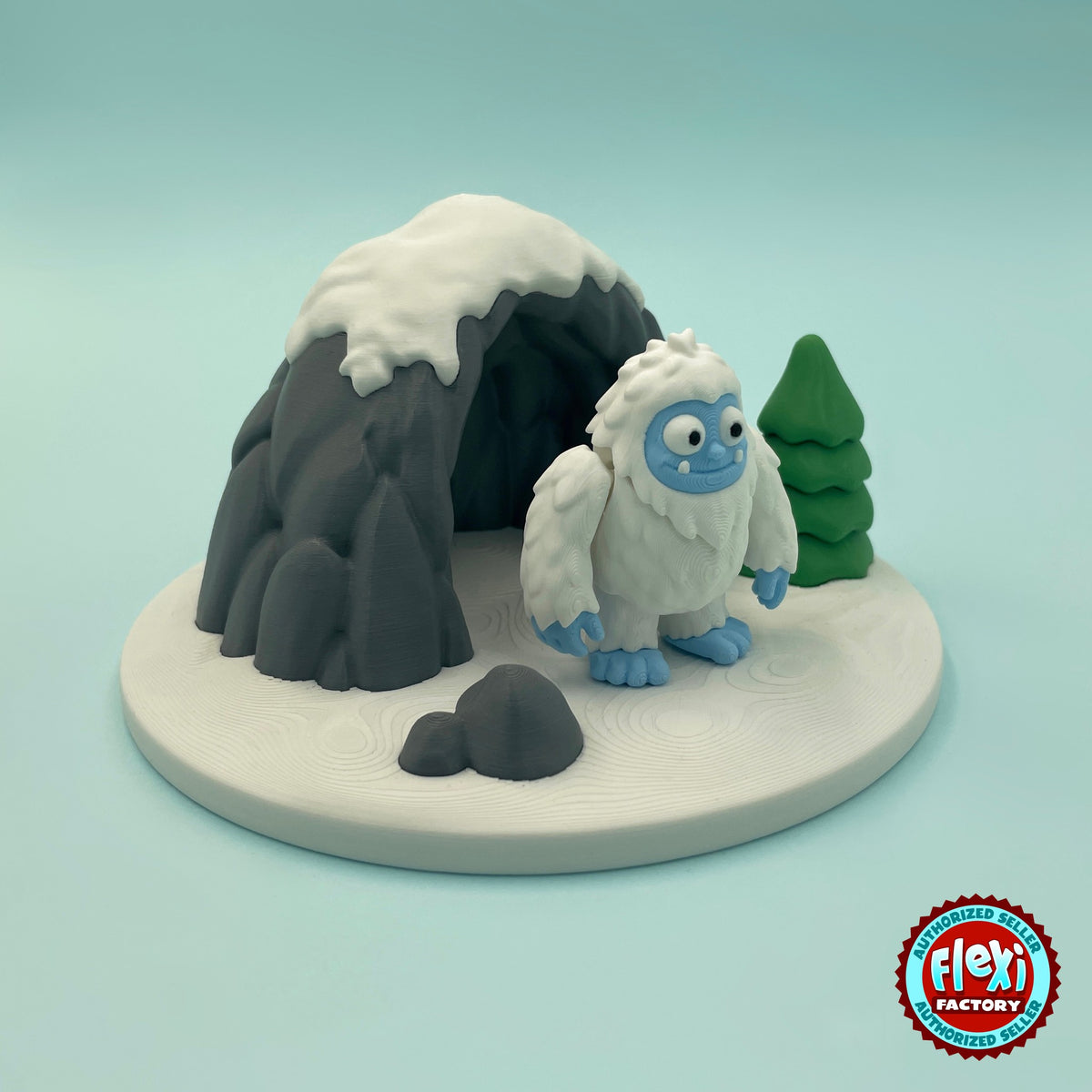Cute abominable snowman yeti keychain, 3D printed by RU3D – three quarter view with ice cave. White fur with blue face and feet.