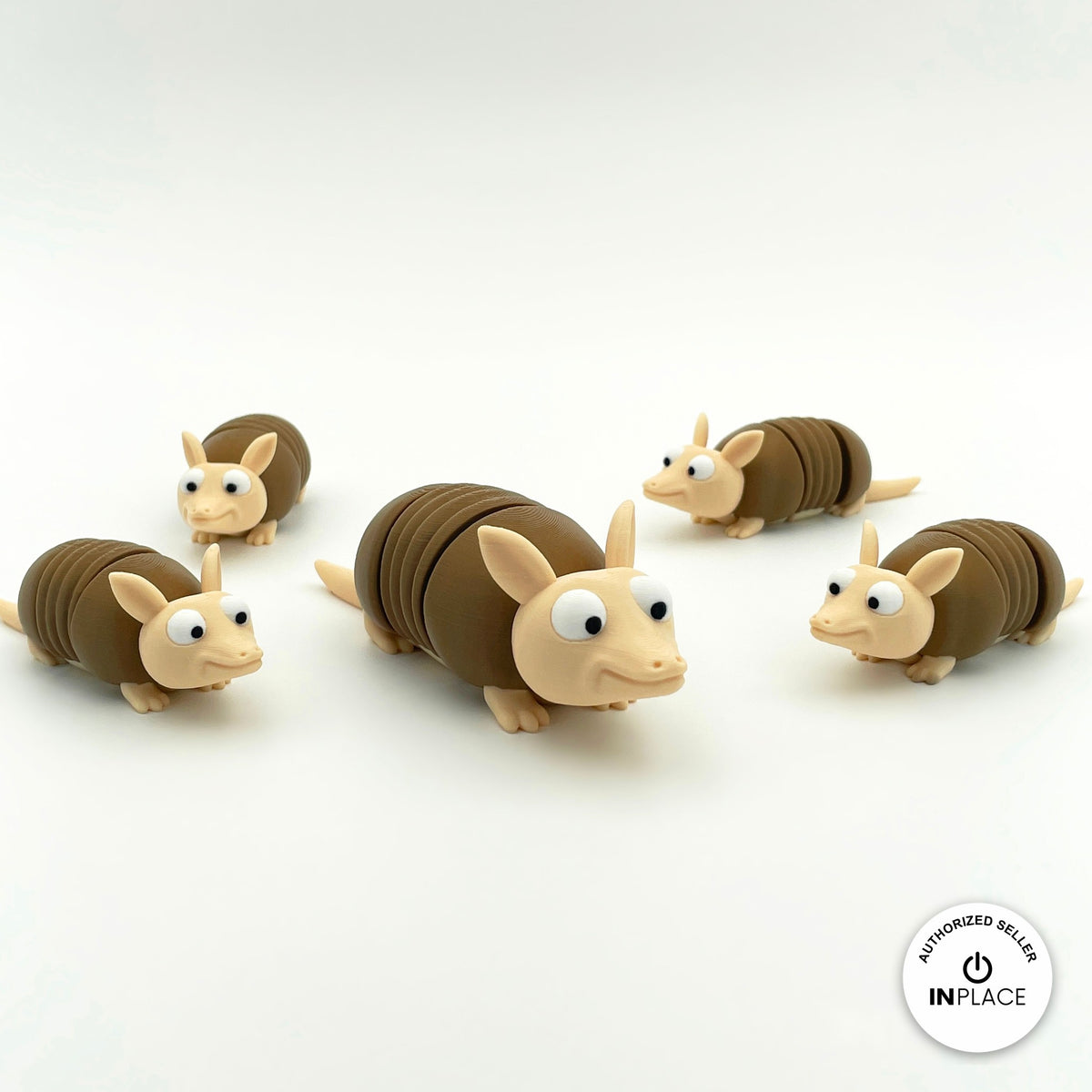 Cute armadillo keychain, 3D printed by RU3D – group of armadillos. Brown shell and beige body.