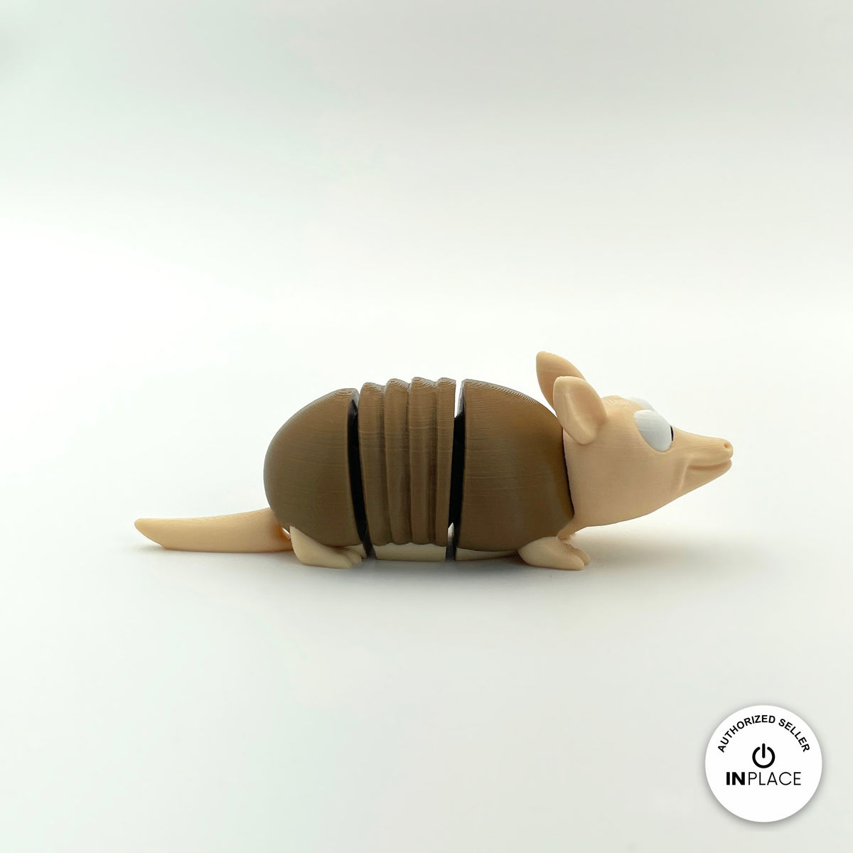 Cute armadillo keychain, 3D printed by RU3D – profile view facing right. Brown shell and beige body.
