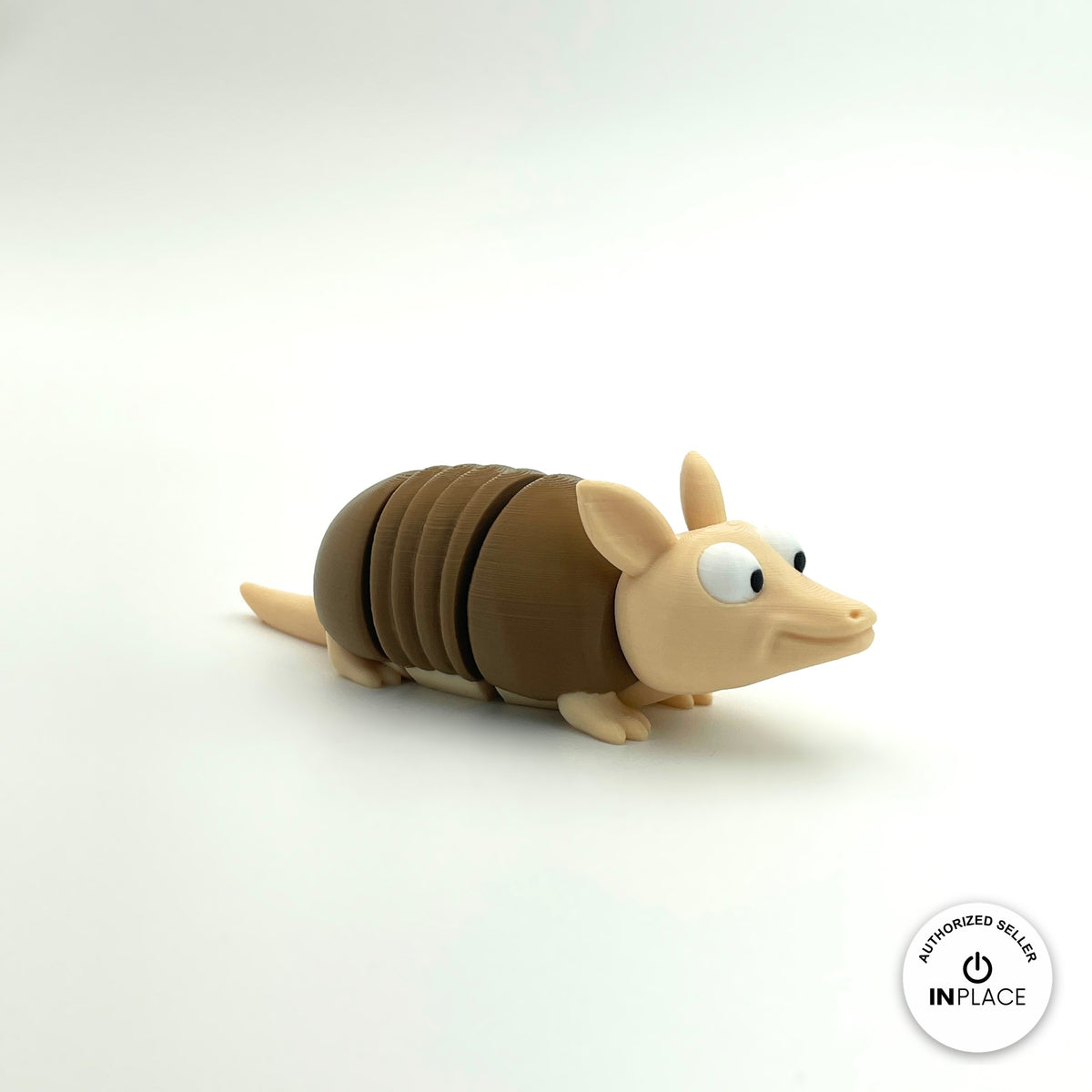 Cute armadillo keychain, 3D printed by RU3D – side view facing right. Brown shell and beige body.