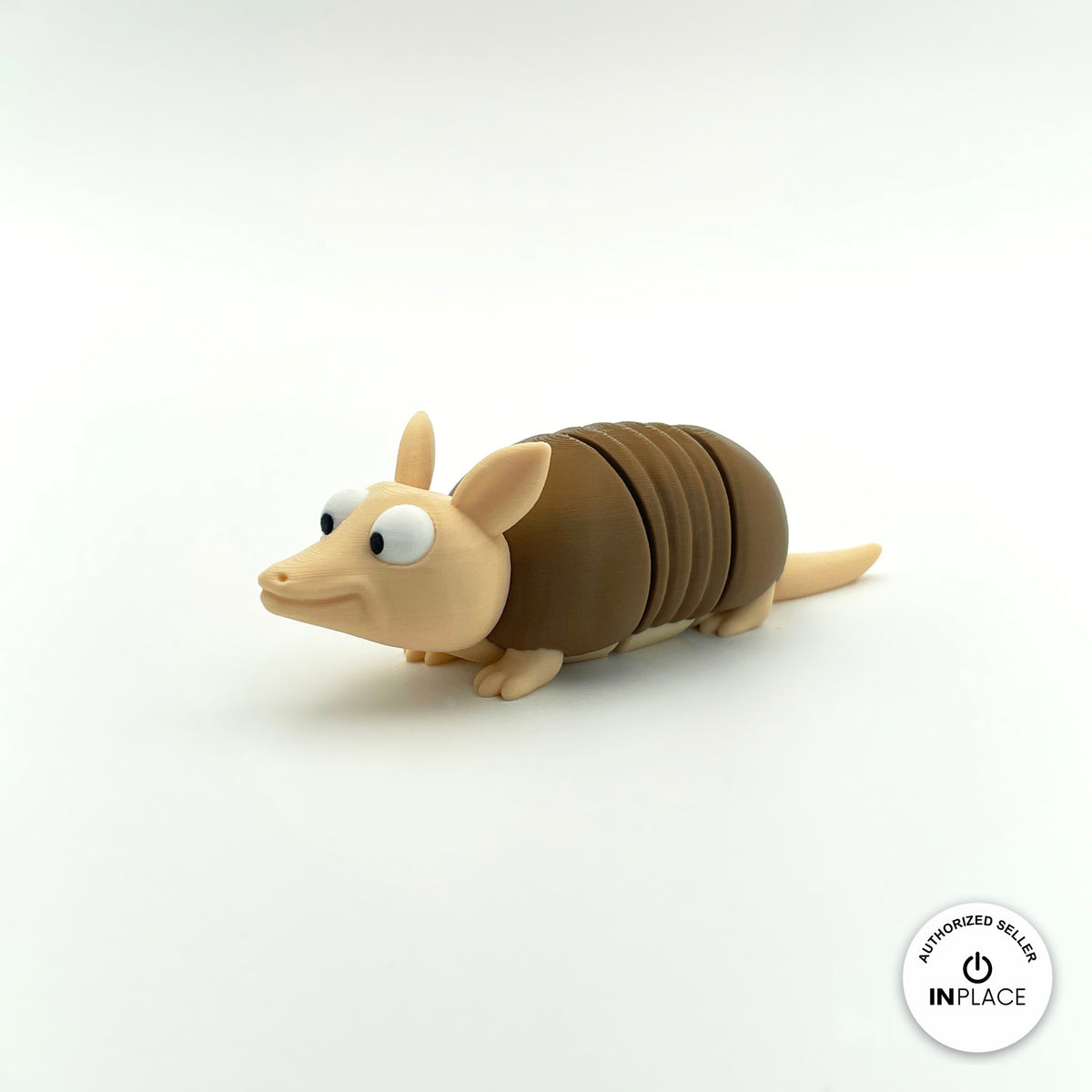 Cute armadillo keychain, 3D printed by RU3D – three quarter view facing left. Brown shell and beige body.