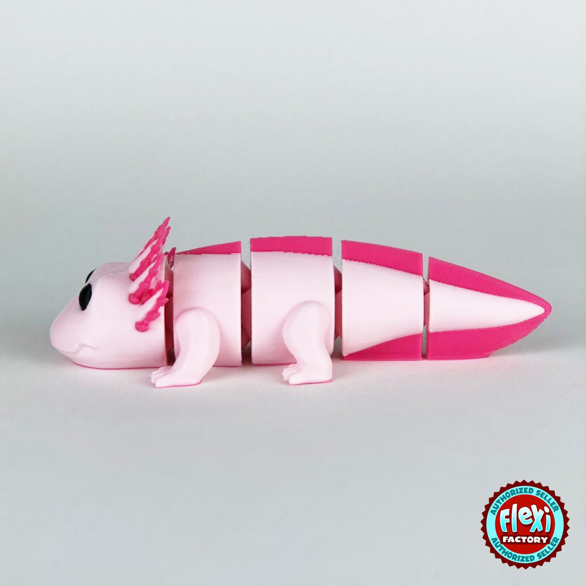 Cute axolotl keychain, 3D printed by RU3D – dark eyes side view facing left. Pink with hot pink gills and tail.