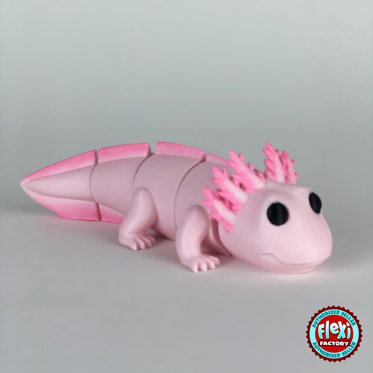 Cute axolotl keychain, 3D printed by RU3D – dark eyes version 2 facing right. Pink with hot pink gills and tail.