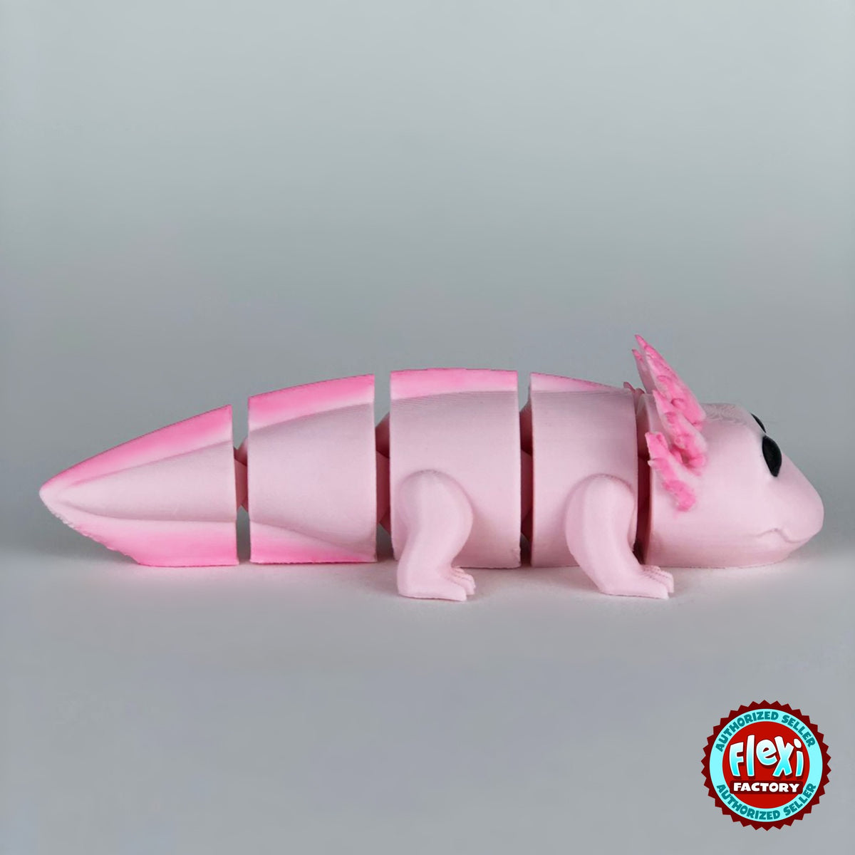 Cute axolotl keychain, 3D printed by RU3D – dark eyes version 2 side view. Pink with hot pink gills and tail.