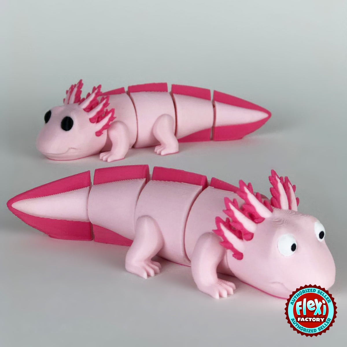 Cute axolotl keychain, 3D printed by RU3D – pair of axolotls facing each way. Pink with hot pink gills and tail.