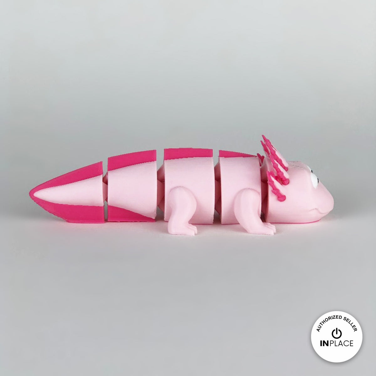 Cute axolotl keychain, 3D printed by RU3D – side view facing right. Pink with hot pink gills and tail.