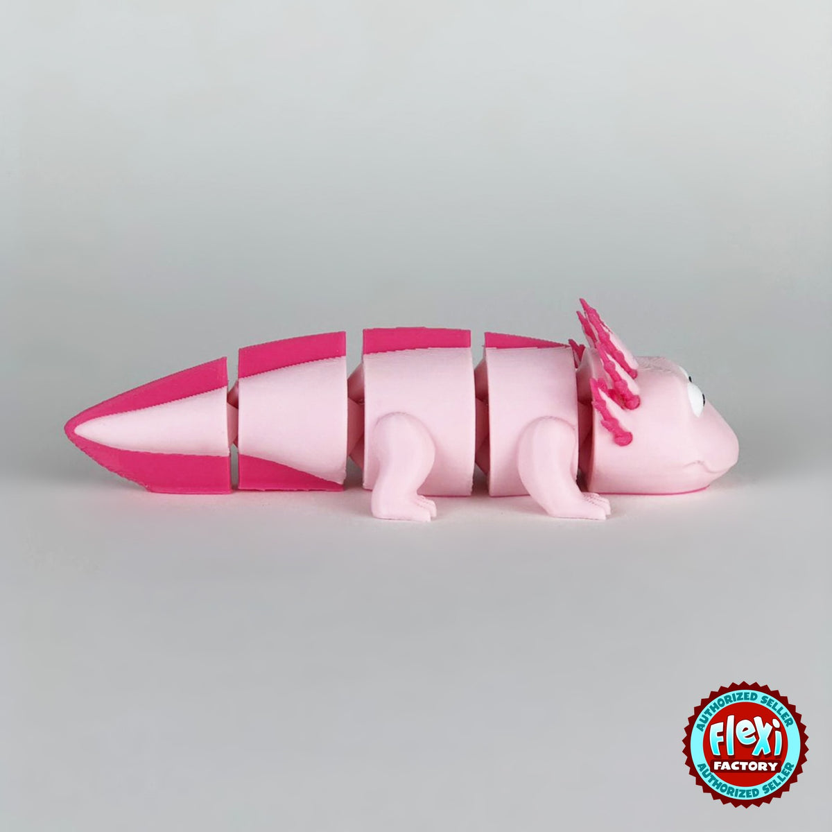 Cute axolotl keychain, 3D printed by RU3D – side view facing right. Pink with hot pink gills and tail.