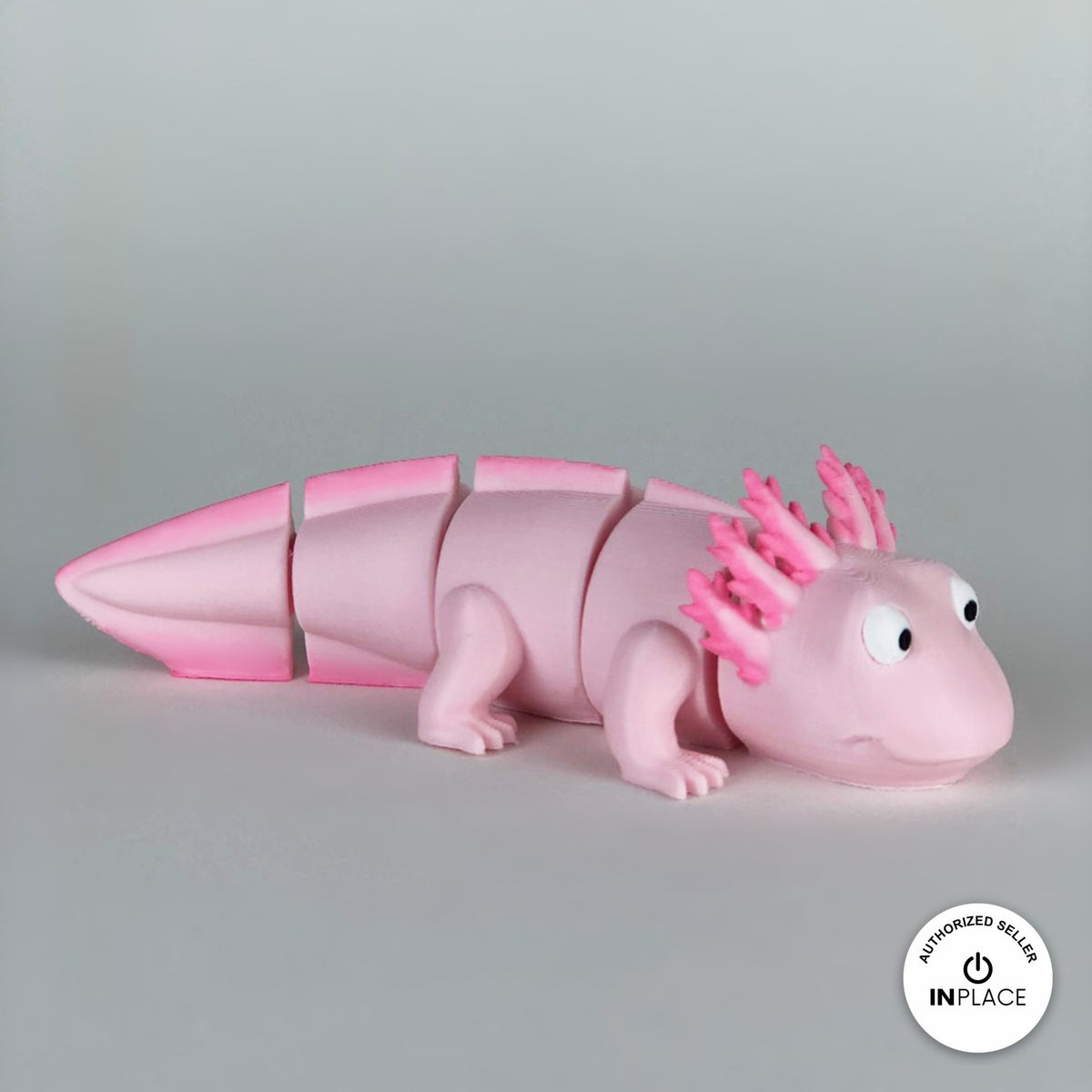 Cute axolotl keychain, 3D printed by RU3D – version 2 three quarter view facing right. Pink with hot pink gills and tail.