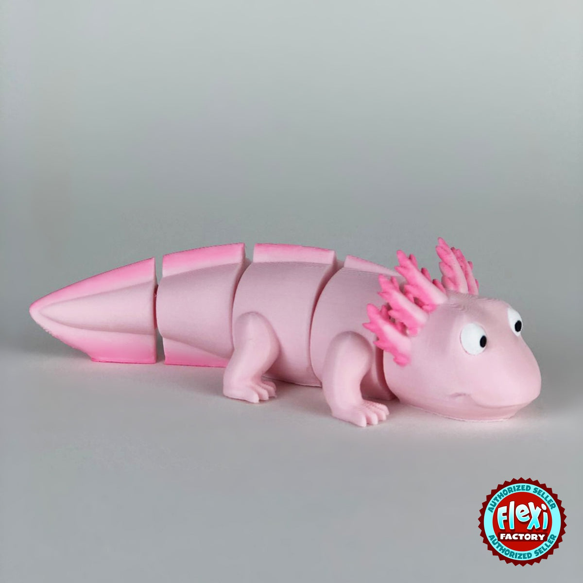 Cute axolotl keychain, 3D printed by RU3D – version 2 three quarter view facing right. Pink with hot pink gills and tail.