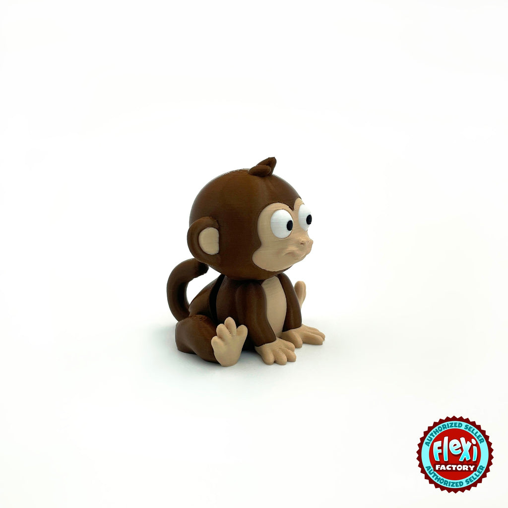 Cute baby monkey keychain, 3D printed by RU3D – sitting side view facing right. Dark brown with tan face.