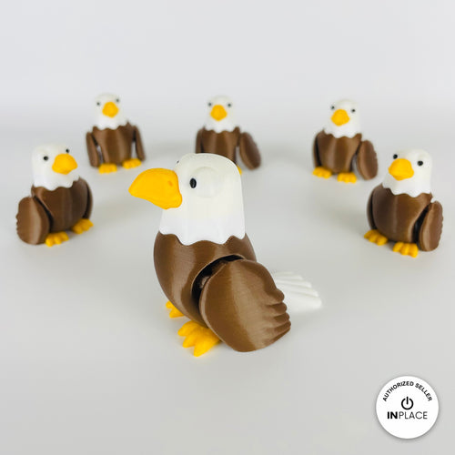 Cute bald eagle keychain, 3D printed by RU3D – group of bald eagles. Brown body, white head and yellow beak.