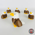 Cute bald eagle keychain, 3D printed by RU3D – group of bald eagles. Brown body, white head and yellow beak.