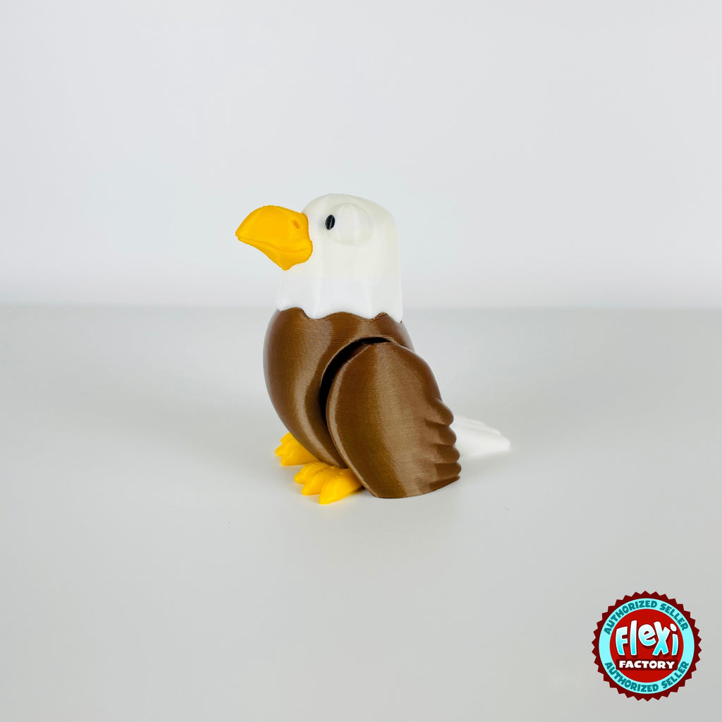 Cute bald eagle keychain, 3D printed by RU3D – standing looking left. Brown body, white head and yellow beak.