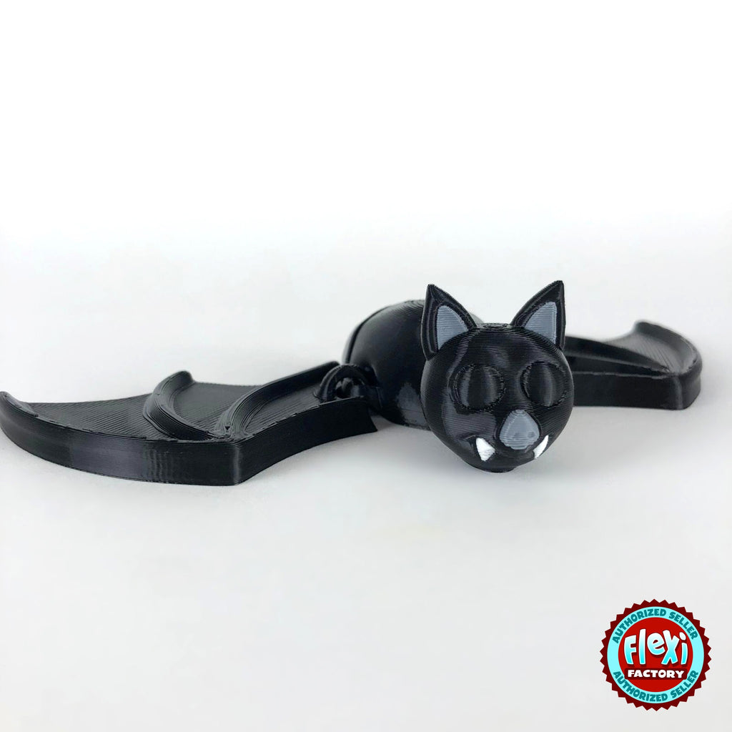 Cute bat keychain, 3D printed by RU3D – dark eyes version wings spread. Black with grey ears and white fangs.
