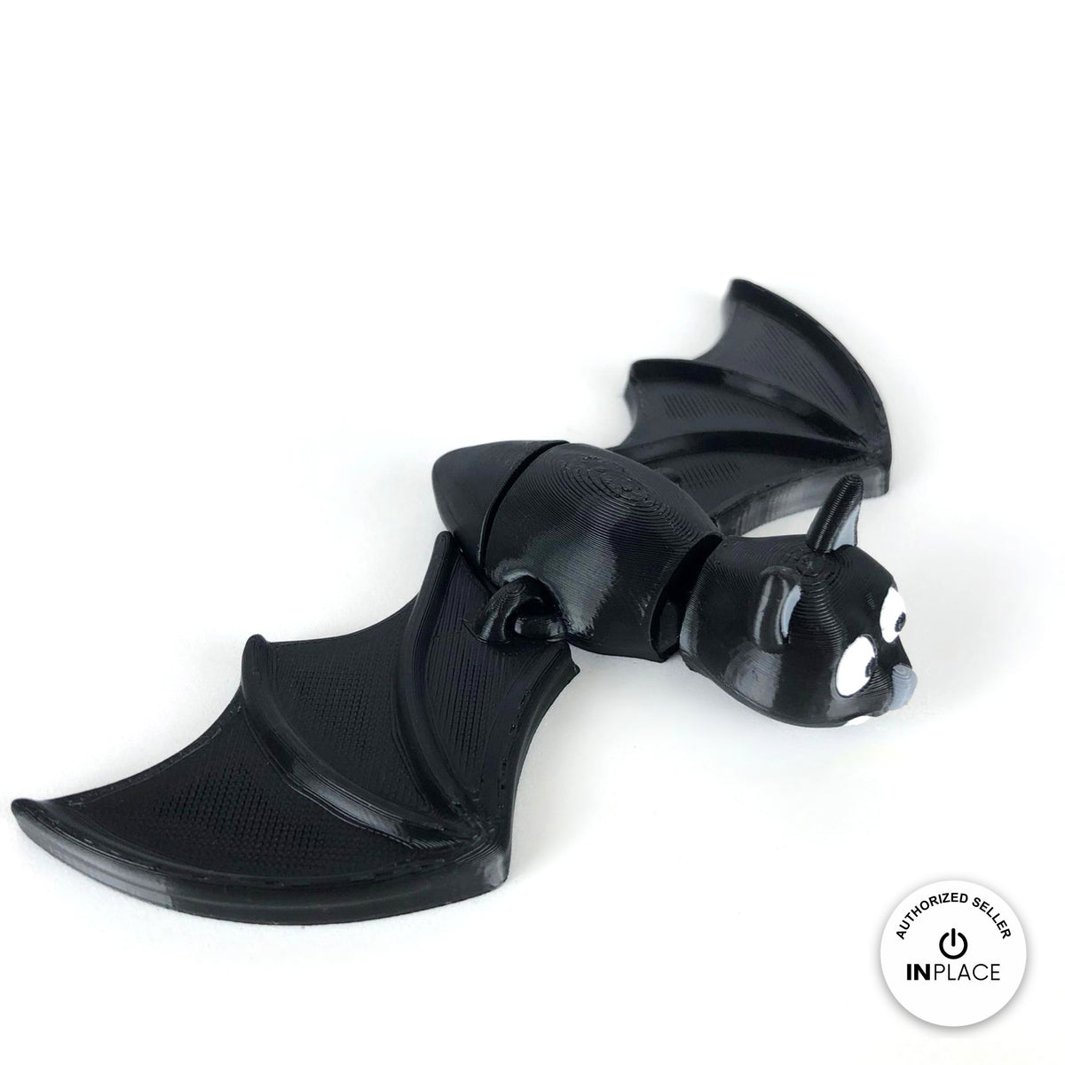 Cute bat keychain, 3D printed by RU3D – top view wings open. Black with grey ears and white fangs.