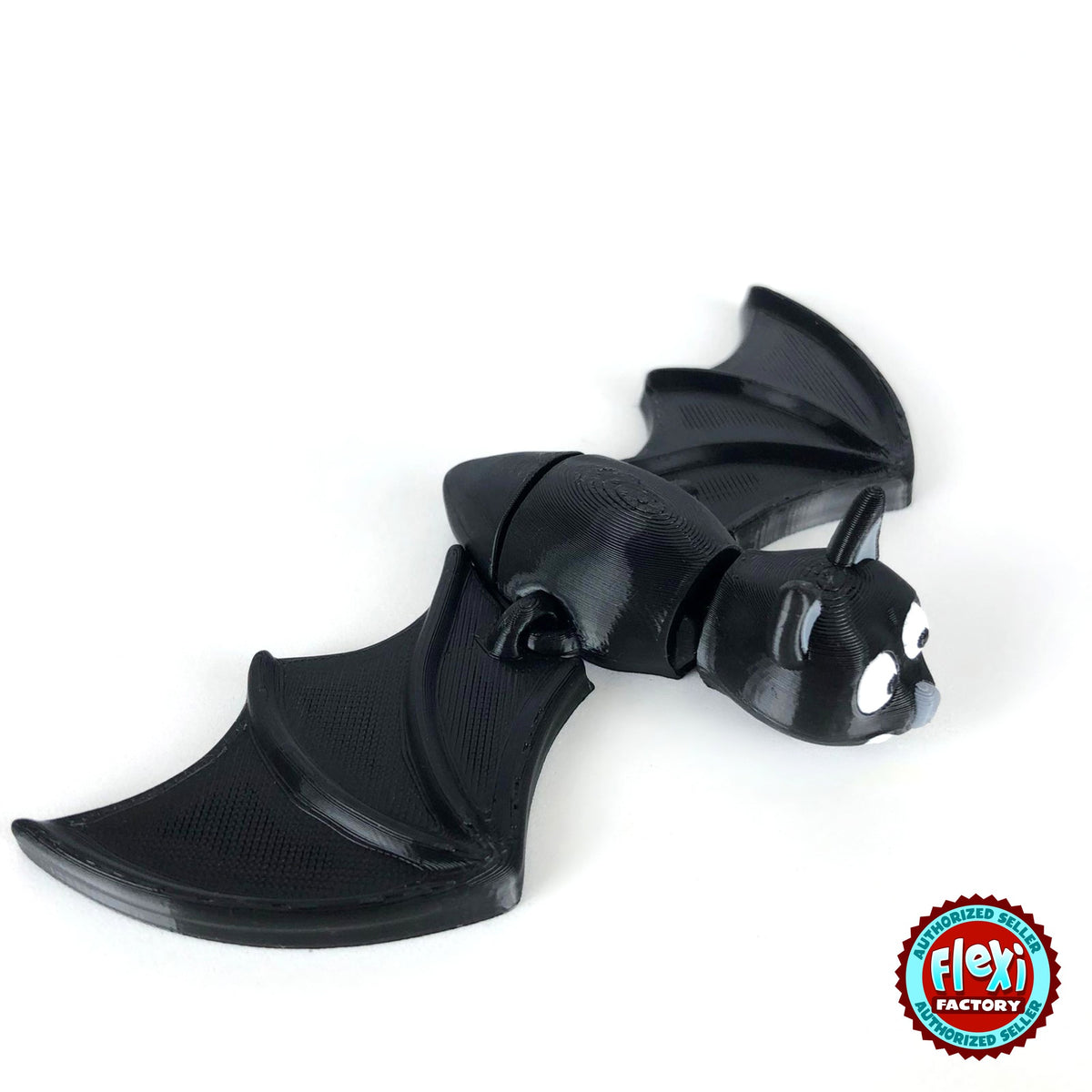 Cute bat keychain, 3D printed by RU3D – top view wings open. Black with grey ears and white fangs.