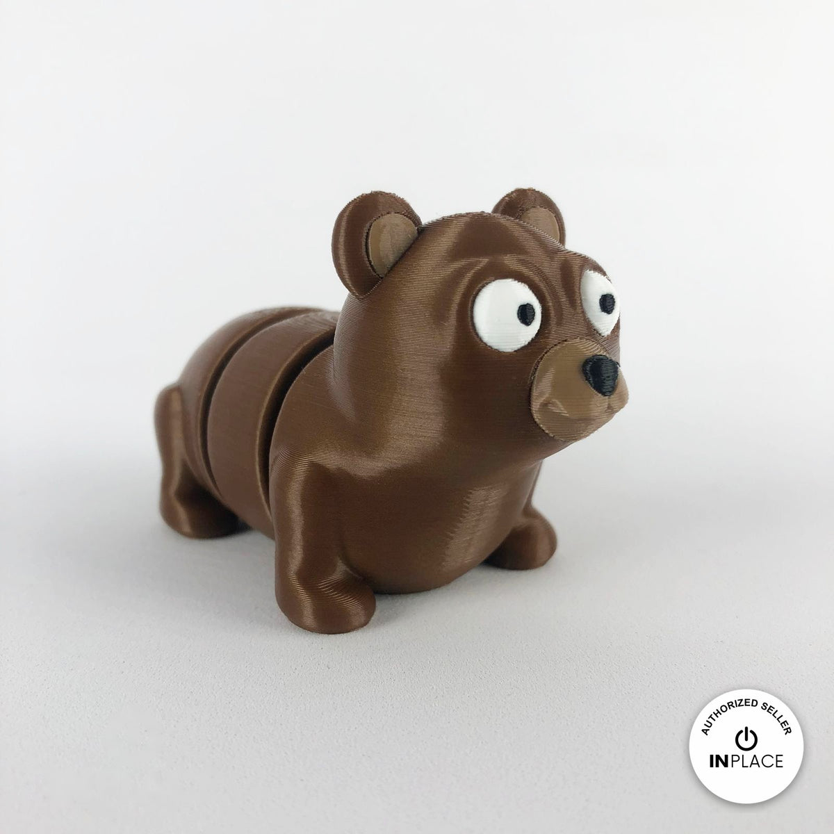 Cute bear keychain, 3D printed by RU3D – three quarter view facing right. Brown.