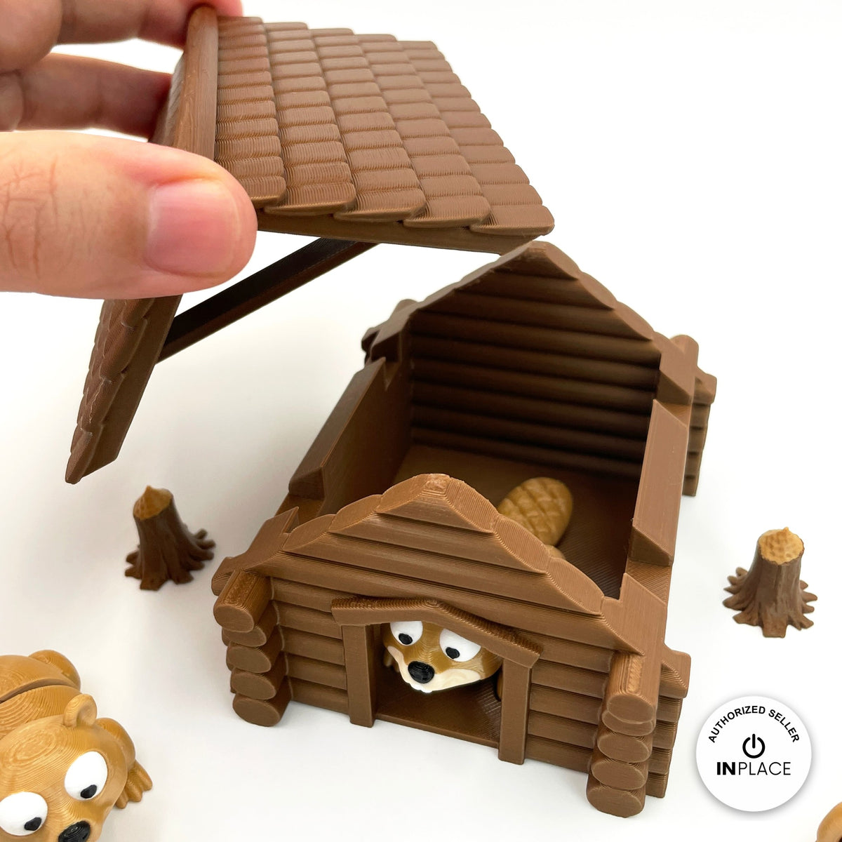 3D printed log cabin platform by RU3D, shown with the Beaver keychain