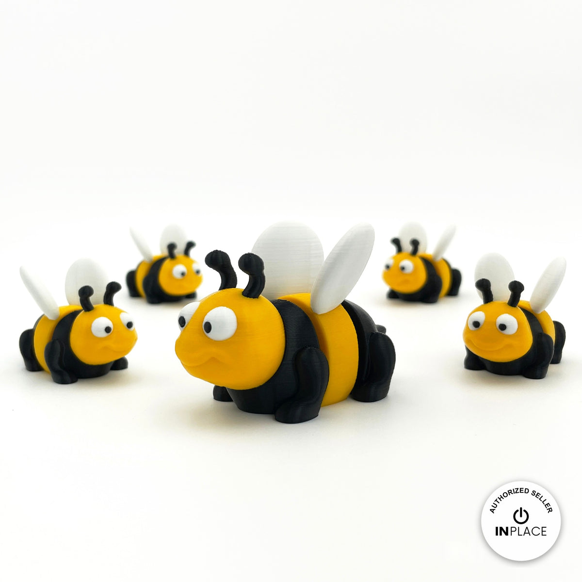 Cute bee keychain, 3D printed by RU3D – group of bees. Yellow and black with white wings.