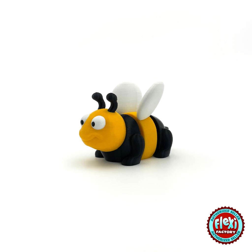 Cute bee keychain, 3D printed by RU3D – three quarter view facing left. Yellow and black with white wings.