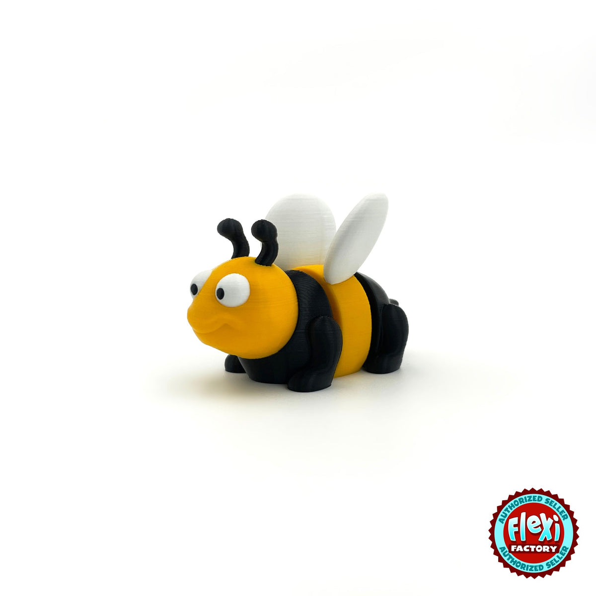 Cute bee keychain, 3D printed by RU3D – three quarter view facing left. Yellow and black with white wings.