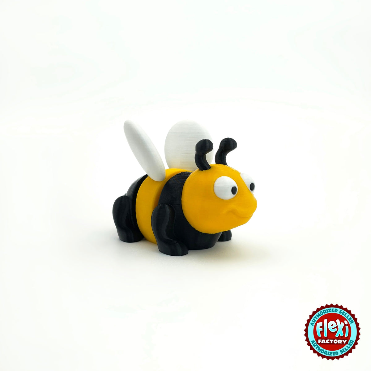 Cute bee keychain, 3D printed by RU3D – three quarter view facing right. Yellow and black with white wings.