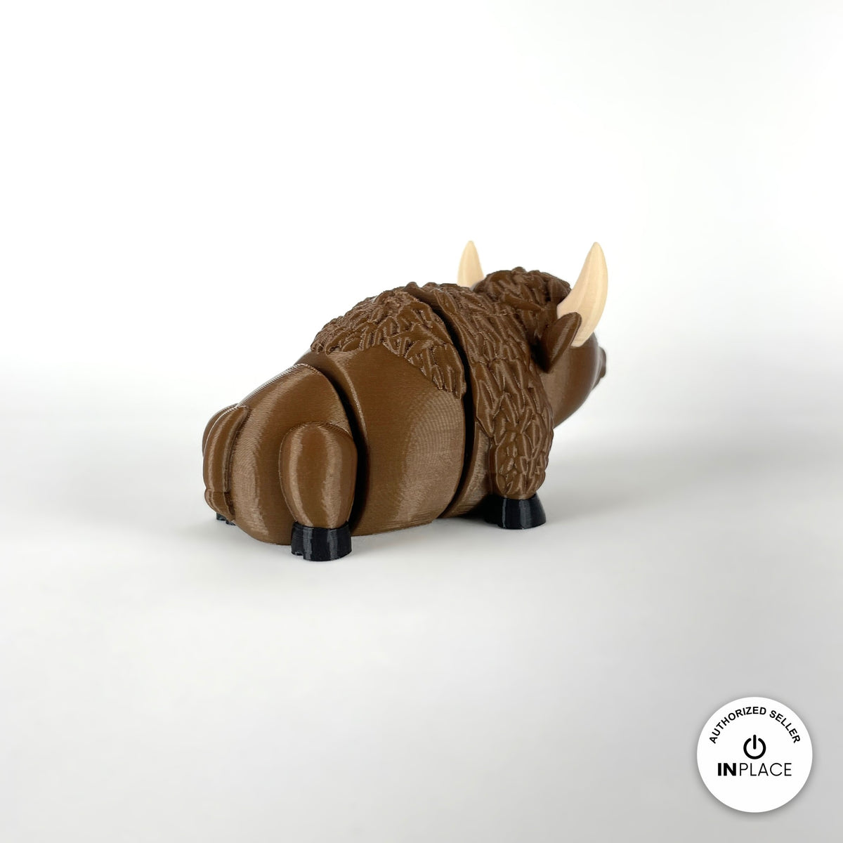 Cute bison keychain, 3D printed by RU3D – rear view. Brown with cream horns and black hooves.
