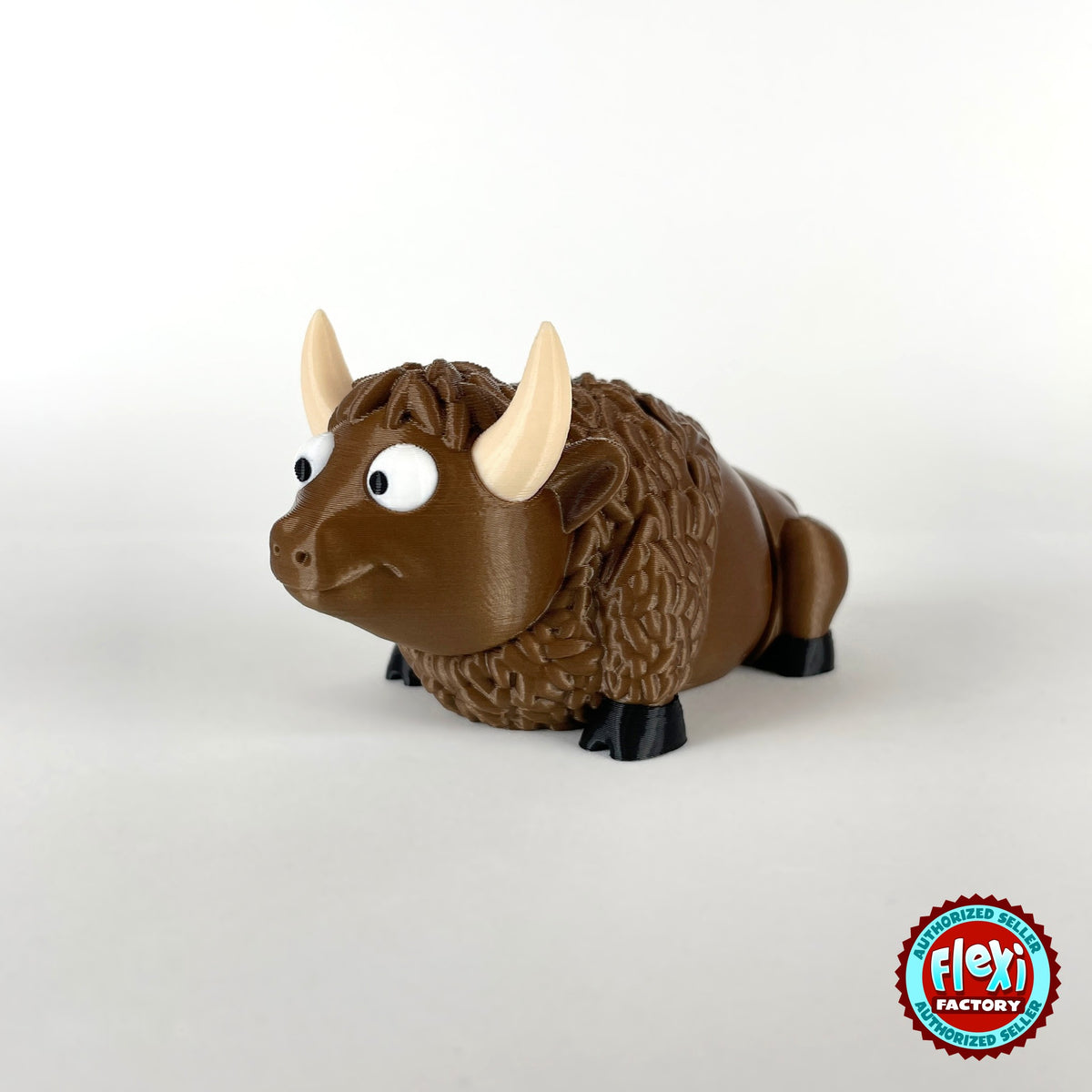Cute bison keychain, 3D printed by RU3D – three quarter view facing left. Brown with cream horns and black hooves.