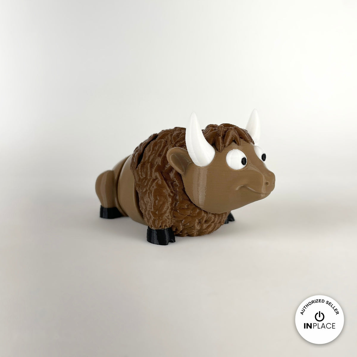 Cute bison keychain, 3D printed by RU3D – three quarter view facing right. Brown with cream horns and black hooves.