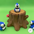 3D printed tree stump box platform by RU3D, shown with the Blue Jay keychain