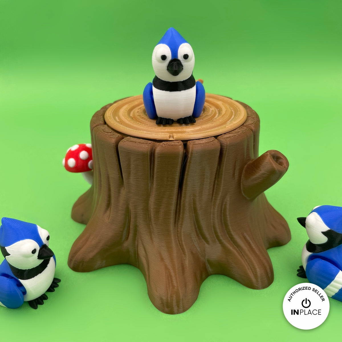 3D printed tree stump box platform by RU3D, shown with the Blue Jay keychain