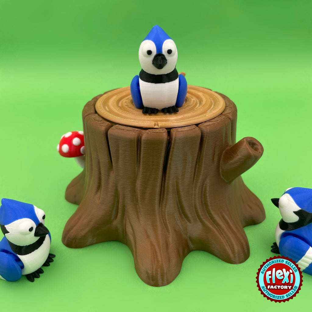 Cute blue jay keychain, 3D printed by RU3D – on tree stump box front view. Blue, white and black bird with tree stump box.