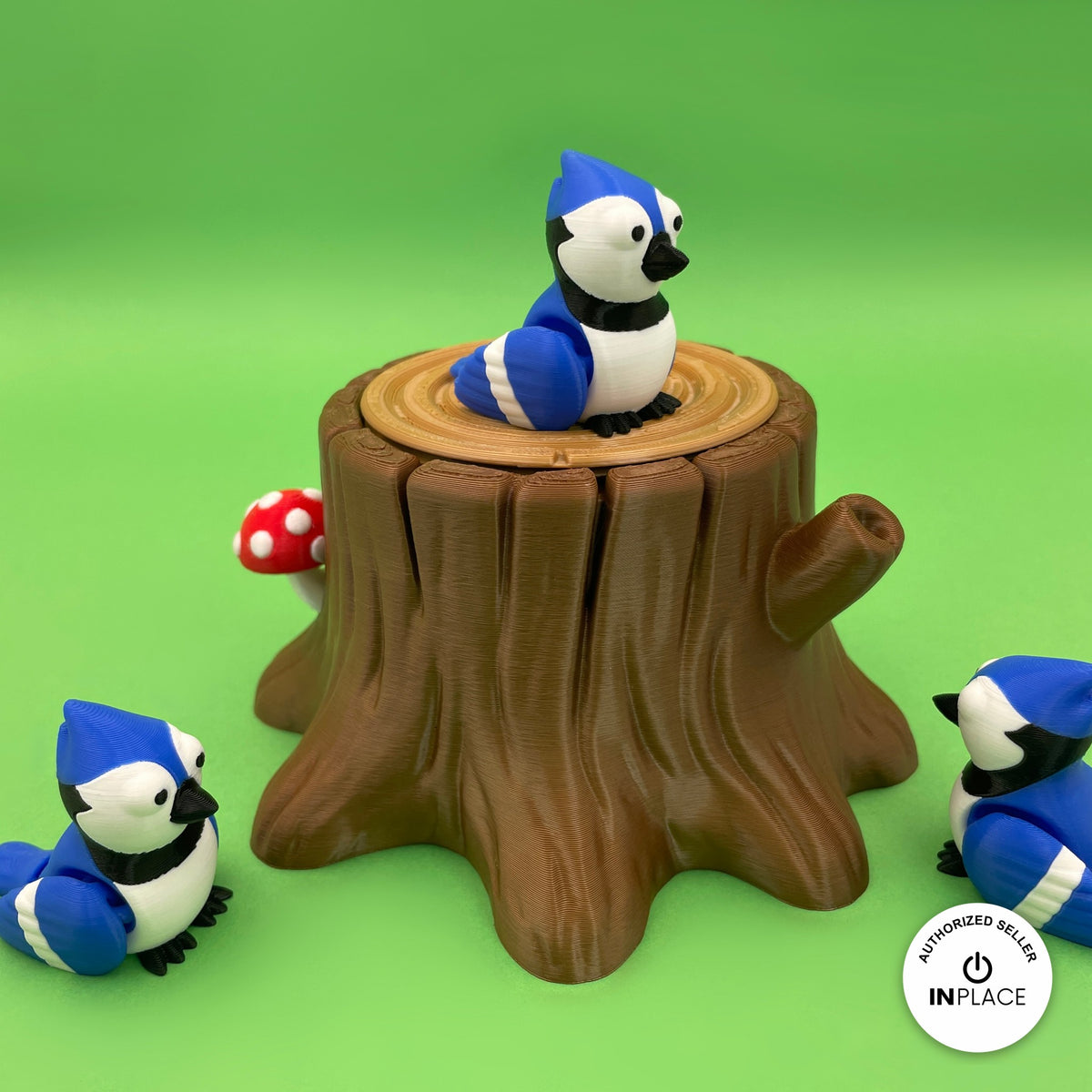 3D printed tree stump box platform by RU3D, shown with the Blue Jay keychain