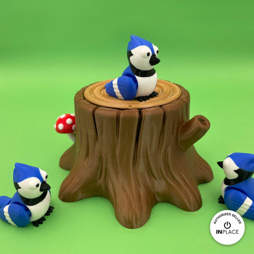 3D printed tree stump box platform by RU3D, shown with the Blue Jay keychain
