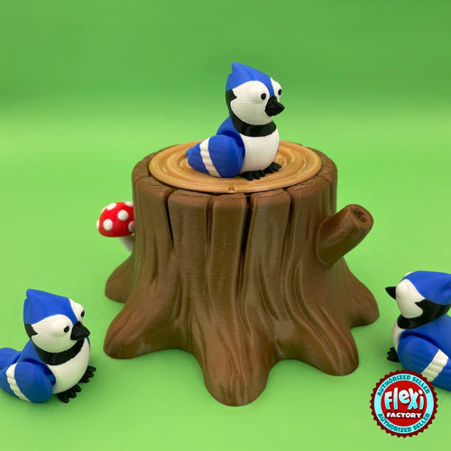 Cute blue jay keychain, 3D printed by RU3D – on tree stump box side view. Blue, white and black bird with tree stump box.
