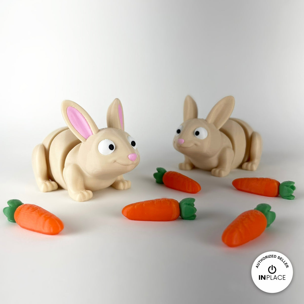 Cute bunny rabbit keychain, 3D printed by RU3D – pair of bunnies with carrots. Cream with pink ears and orange carrots.