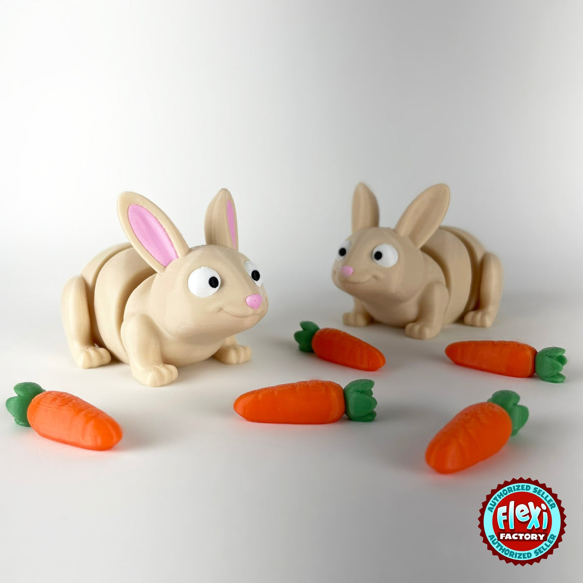 Cute bunny rabbit keychain, 3D printed by RU3D – pair of bunnies with carrots. Cream with pink ears and orange carrots.