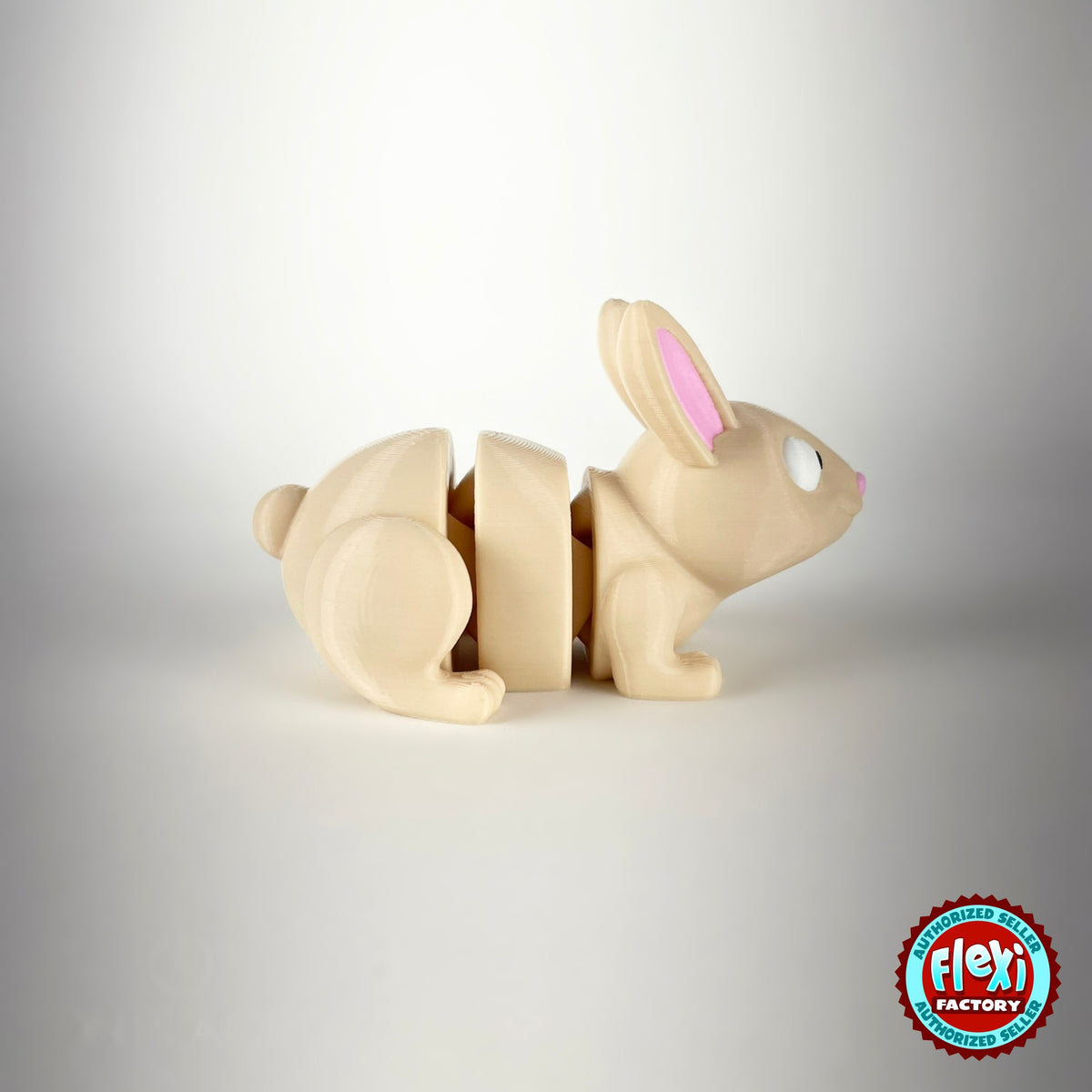 Cute bunny rabbit keychain, 3D printed by RU3D – side view facing right. Cream with pink ears and orange carrots.