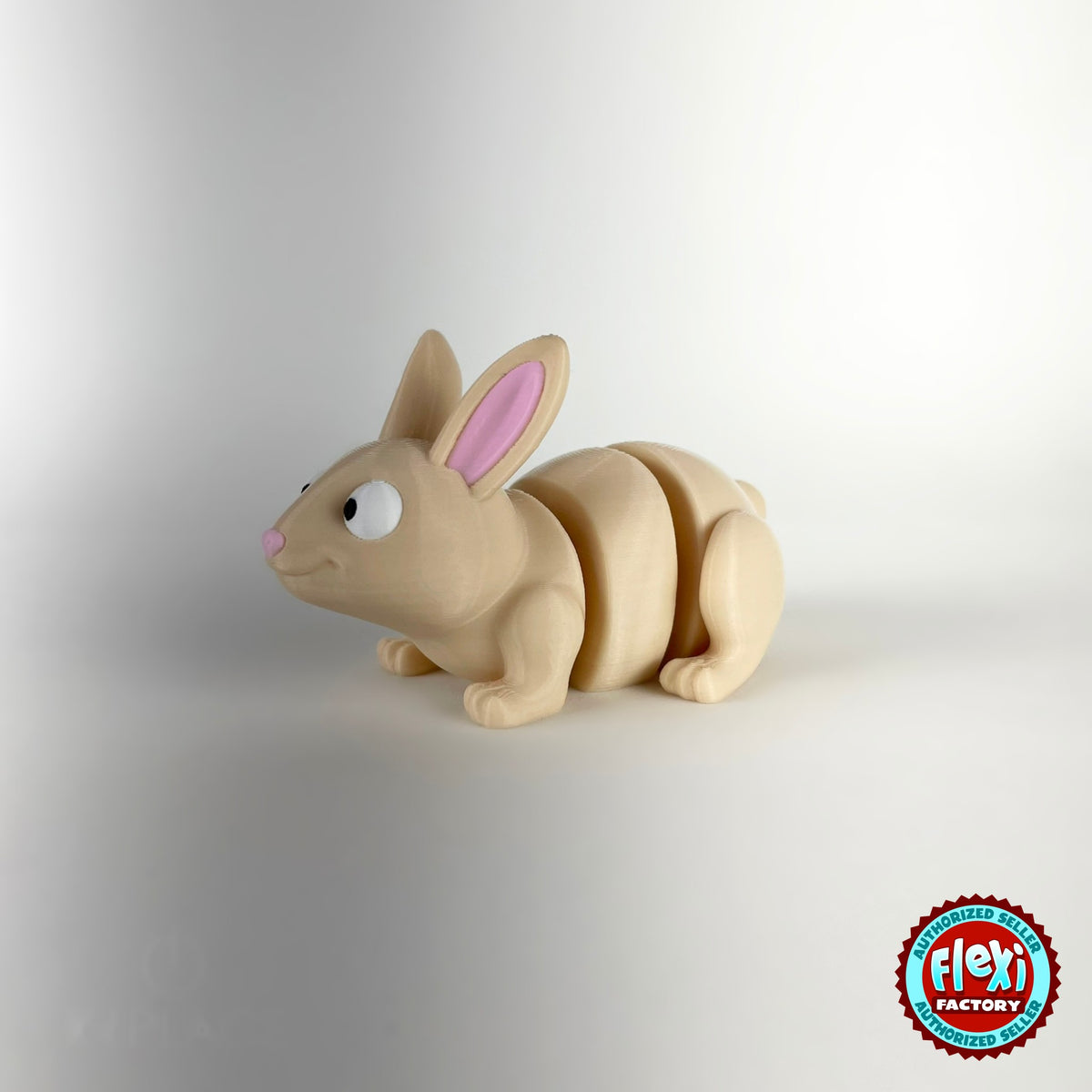 Cute bunny rabbit keychain, 3D printed by RU3D – three quarter view facing left. Cream with pink ears and orange carrots.