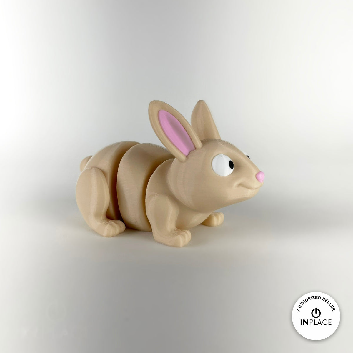 Cute bunny rabbit keychain, 3D printed by RU3D – three quarter view facing right. Cream with pink ears and orange carrots.