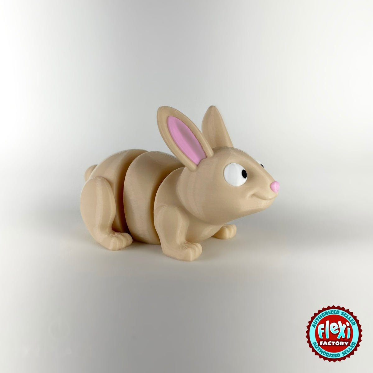 Cute bunny rabbit keychain, 3D printed by RU3D – three quarter view facing right. Cream with pink ears and orange carrots.