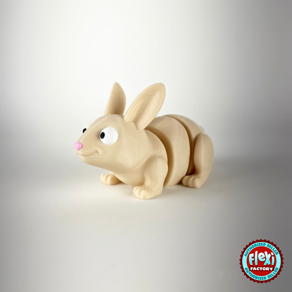 Cute bunny rabbit keychain, 3D printed by RU3D – three quarter view looking left. Cream with pink ears and orange carrots.