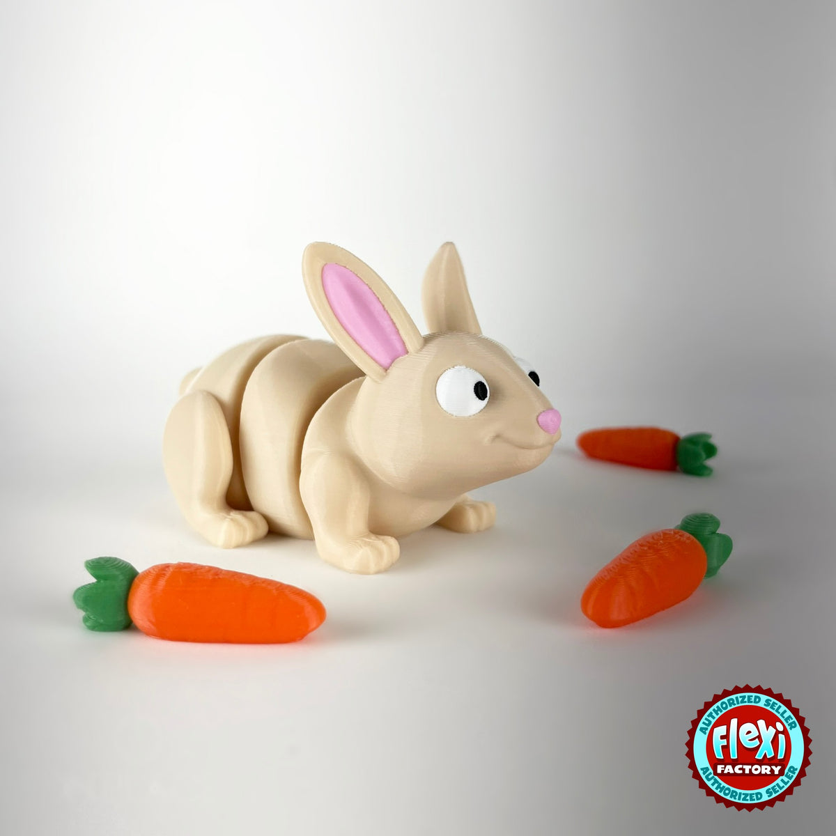 Cute bunny rabbit keychain, 3D printed by RU3D – with carrots facing right. Cream with pink ears and orange carrots.