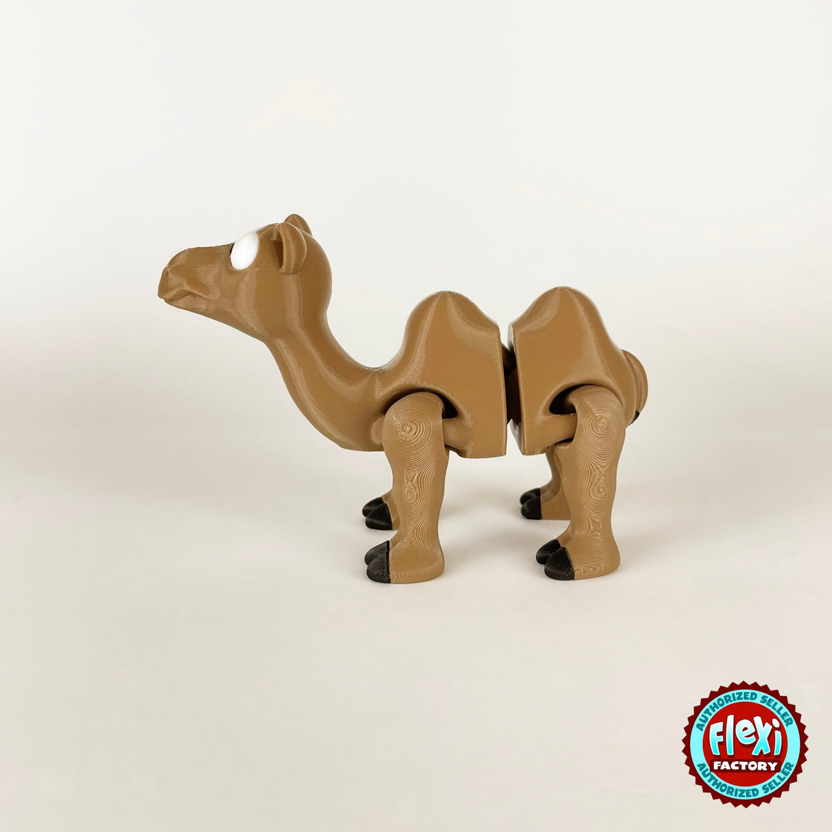 Cute camel keychain, 3D printed by RU3D – side view facing left. Tan brown with black hooves.