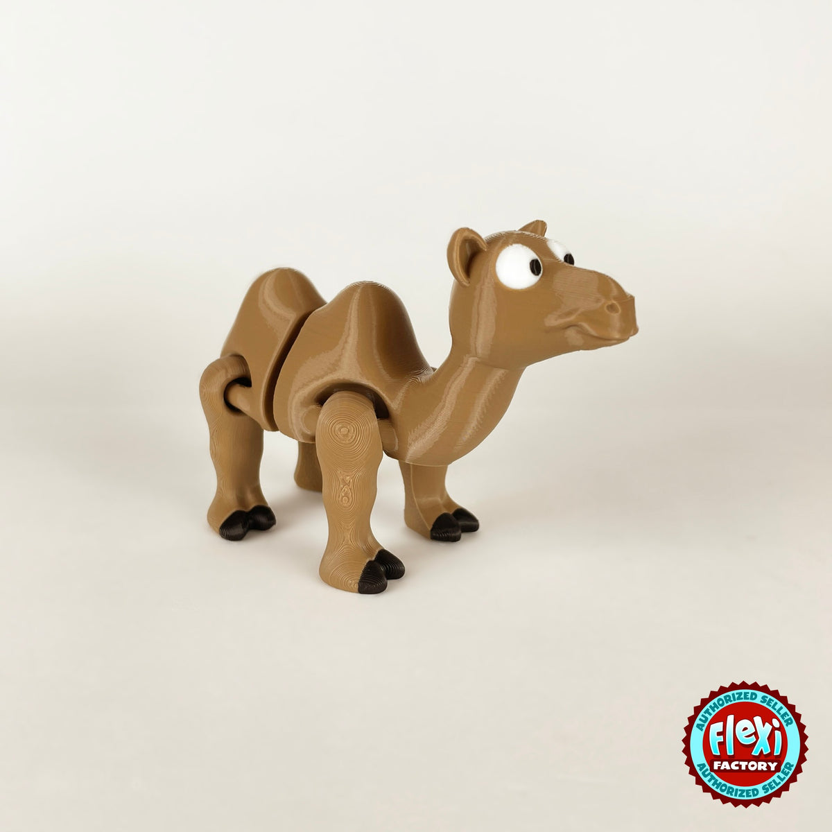 Cute camel keychain, 3D printed by RU3D – three quarter view facing right. Tan brown with black hooves.